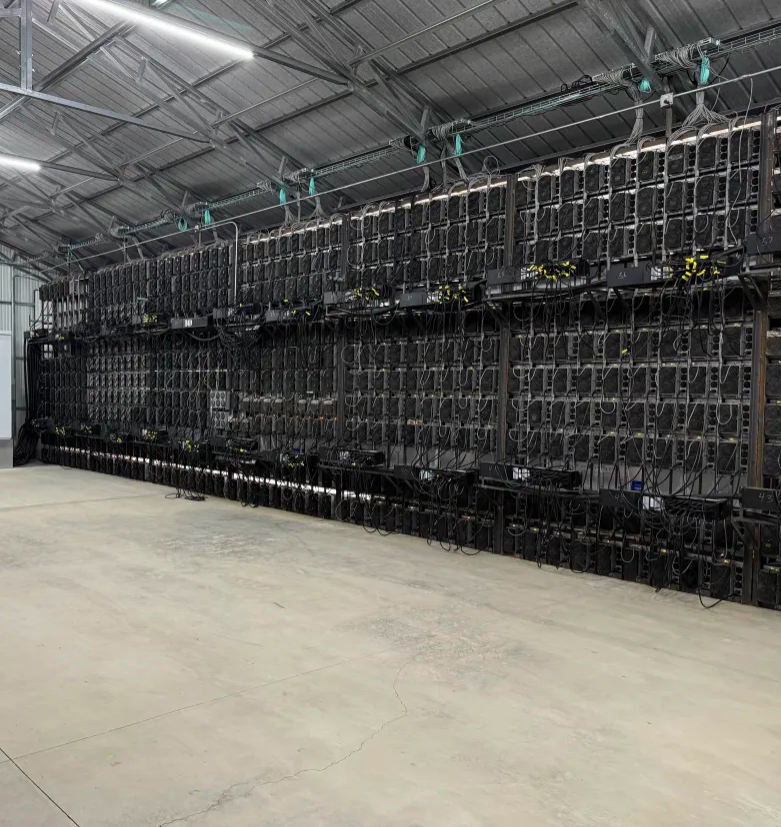 Rows of miners on the cold aisle of a DigiEgg facility